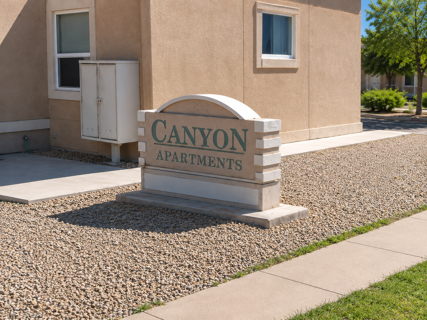 Canyon Apartments property sign beside the apartment building